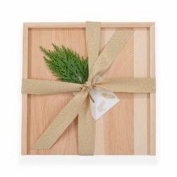 golden bow on a wooden gift box